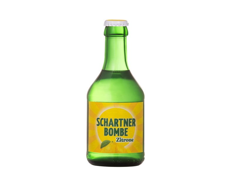Green bottle labelled Schartner Bombe ©  Starzinger GmbH & Co KG