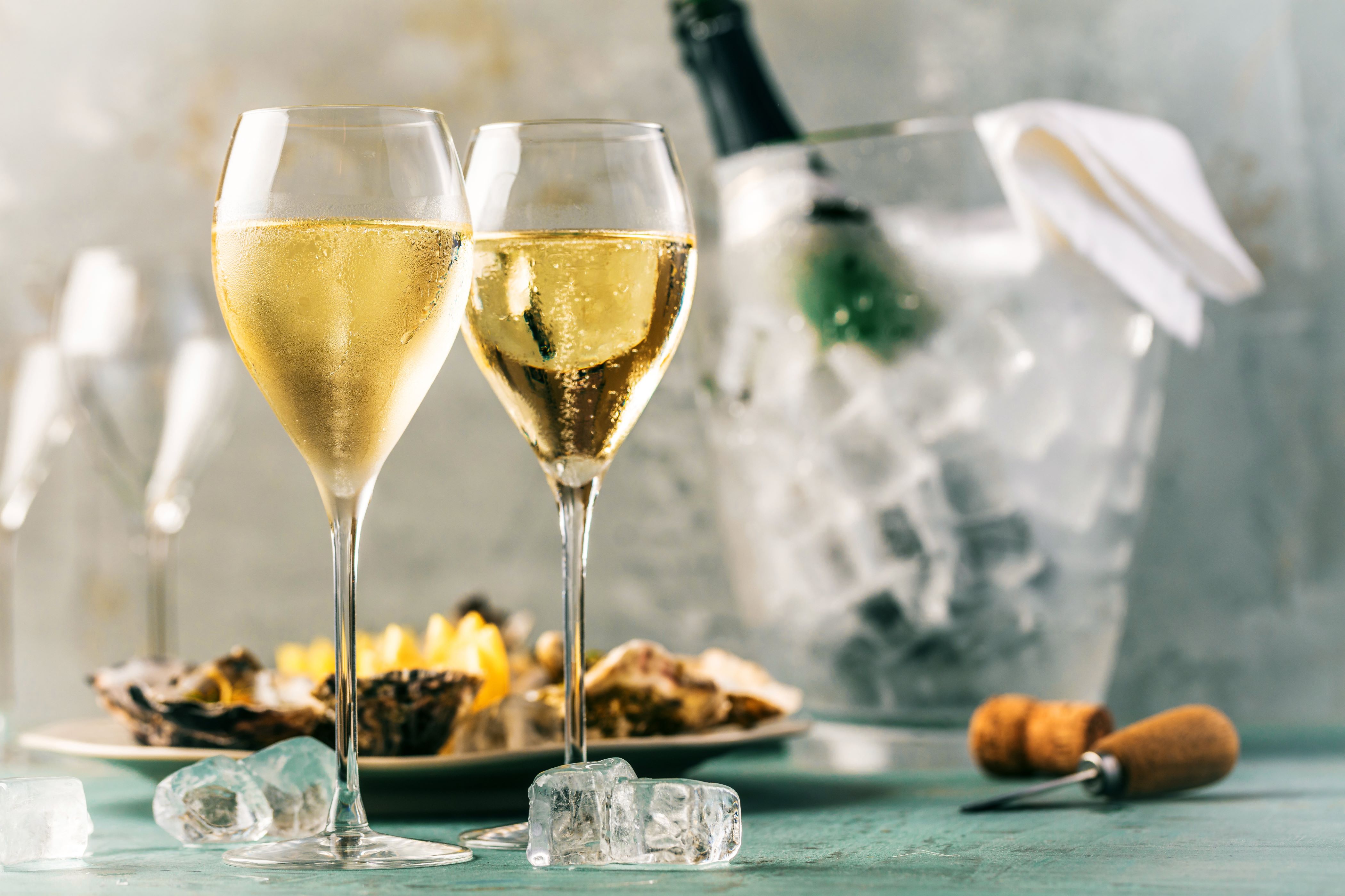 Two glasses of Champagne on a table next to some food © karepa | stock.adobe.com
